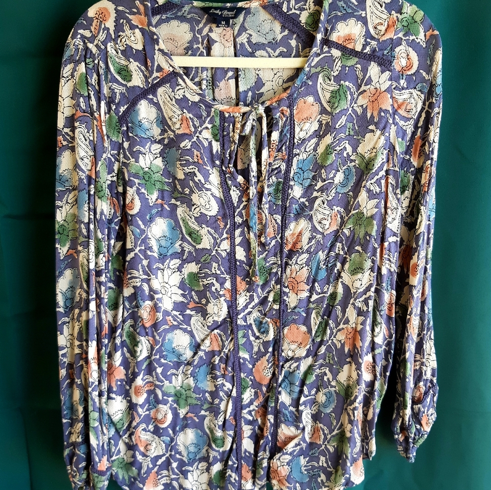 Long sleeve, loose fitting Top.